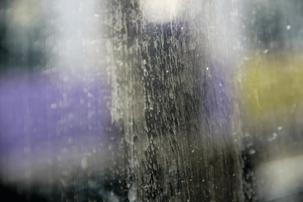 Close up detail shot of hard water stains on glass