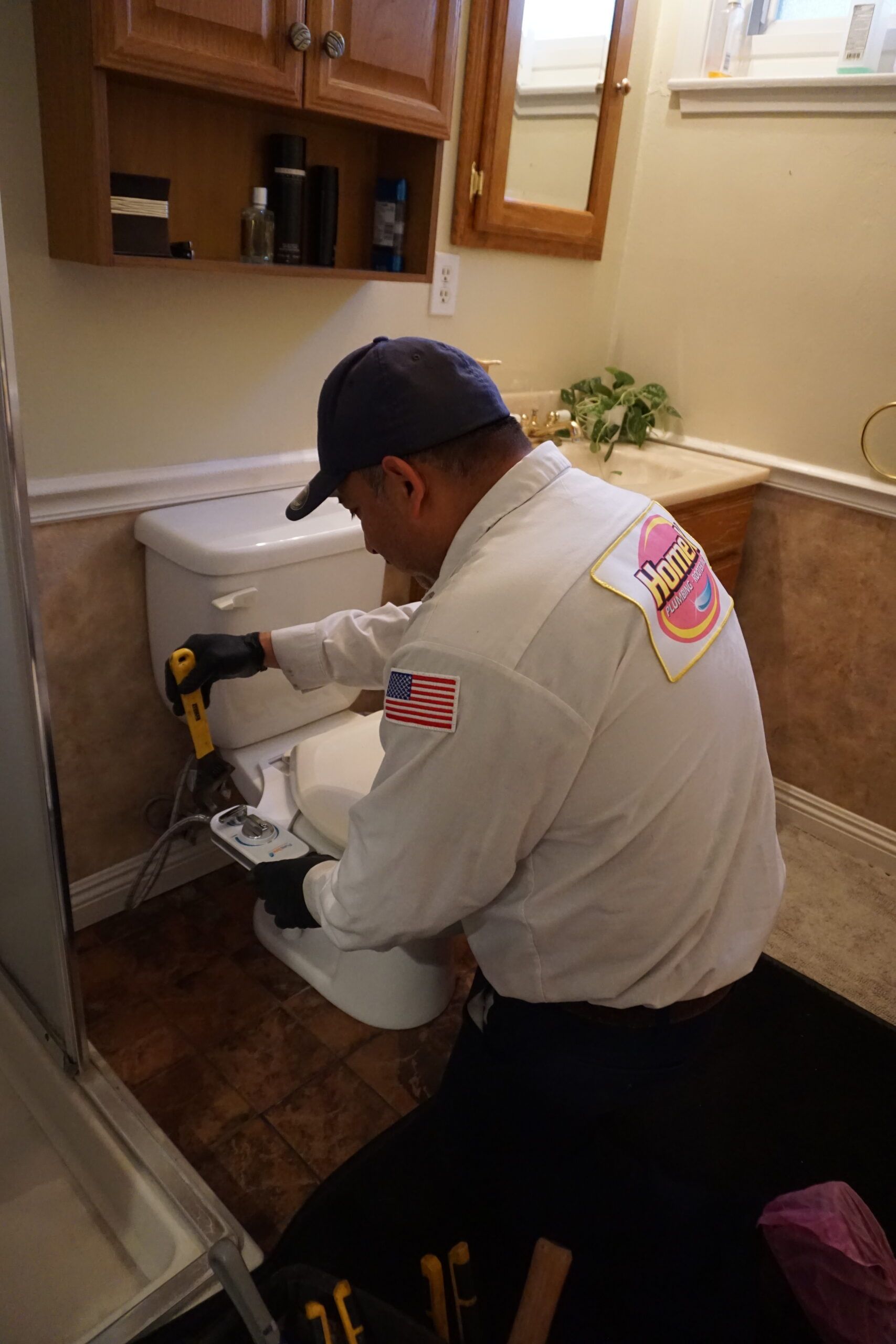 plumber providing toilet repair service
