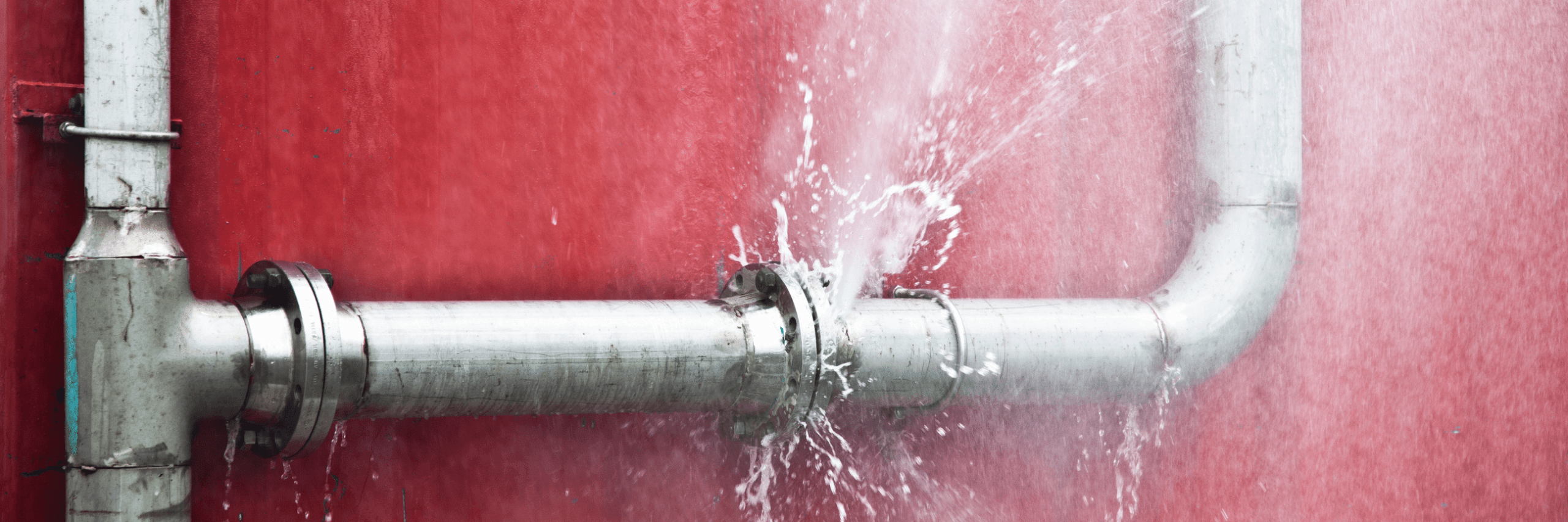 water leaking from a burst pipe