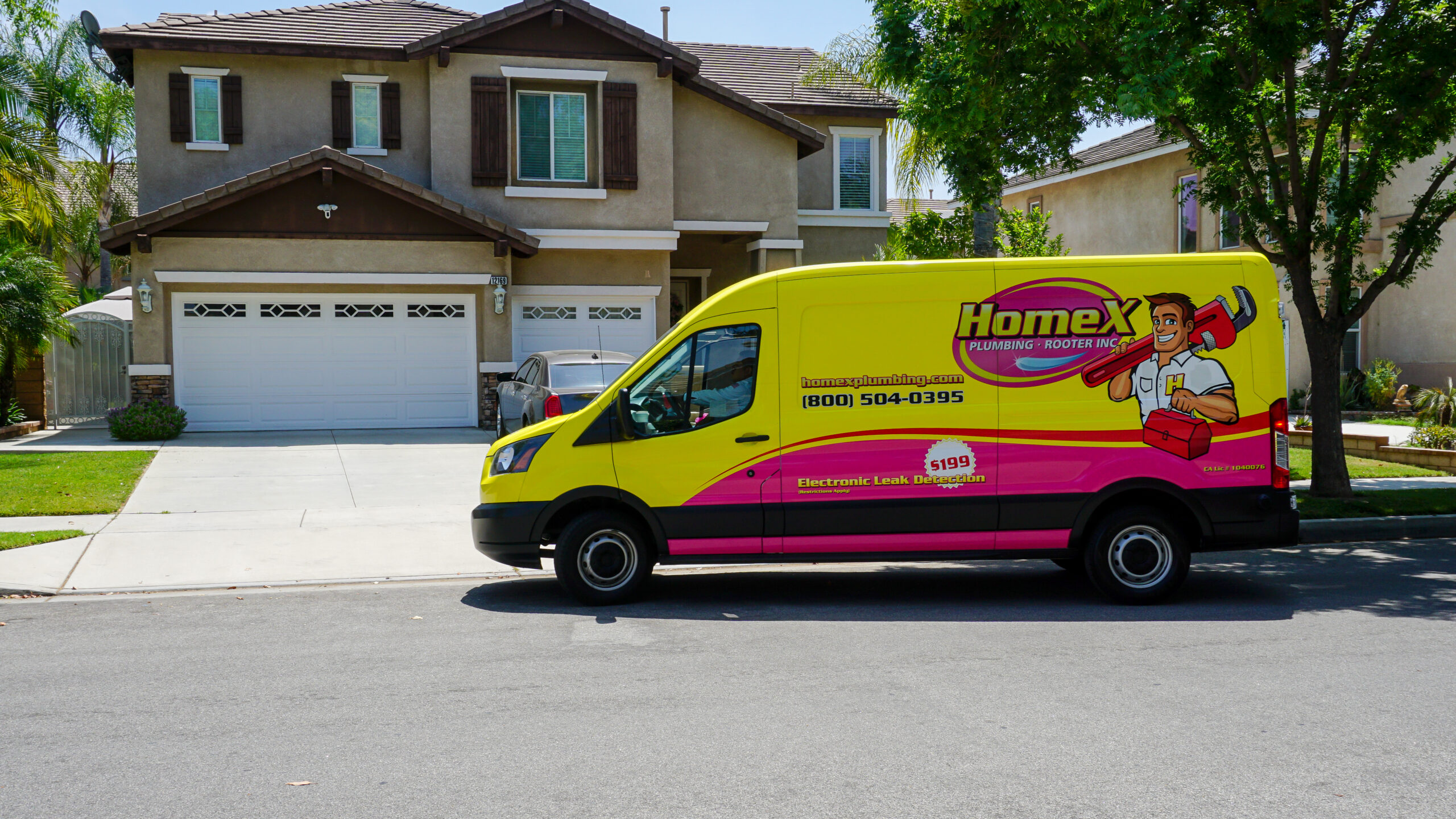 Kahuna Comfort Plumbing & Rooter van outside home